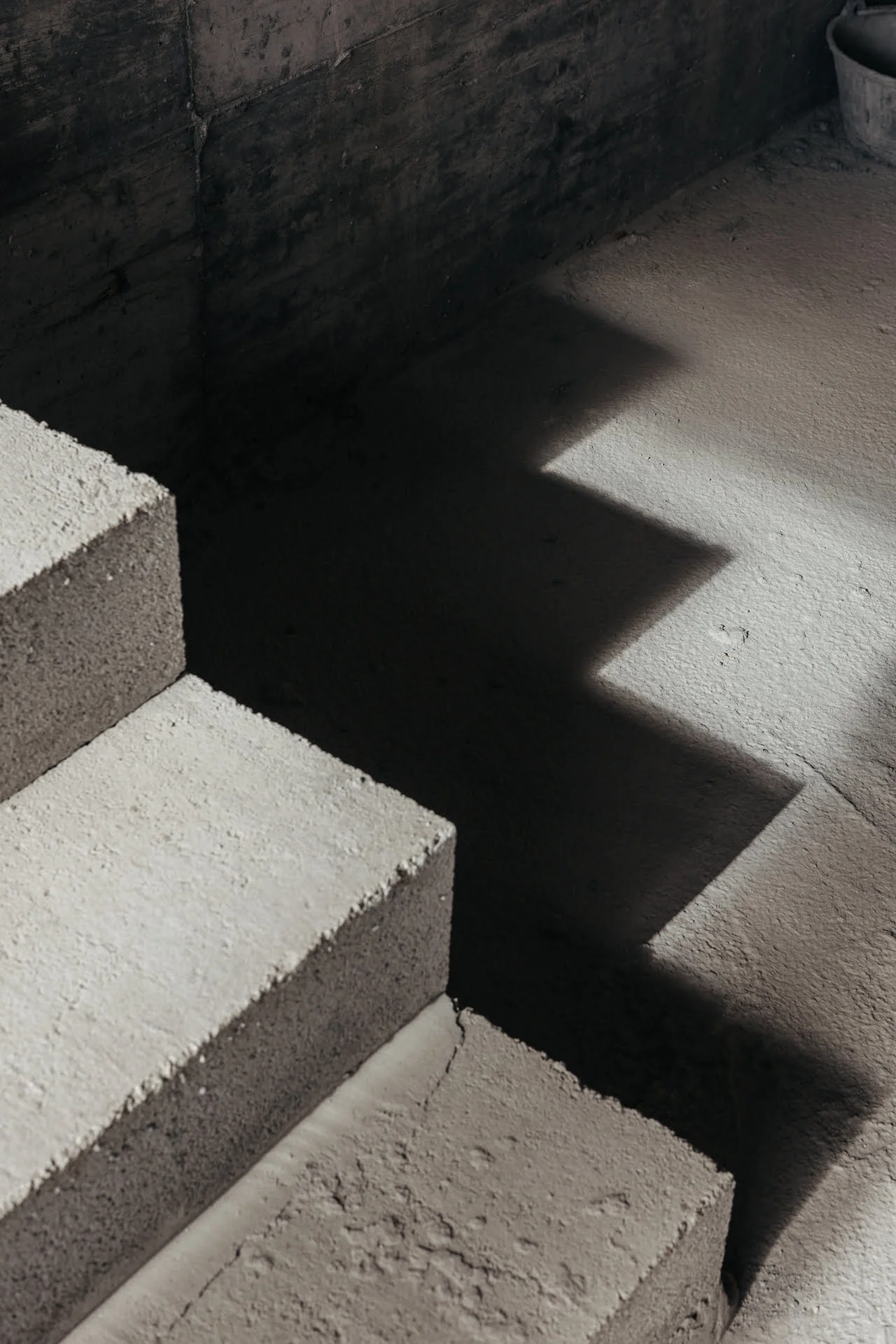 Concrete staircase in light and shadow — Archidom Lab