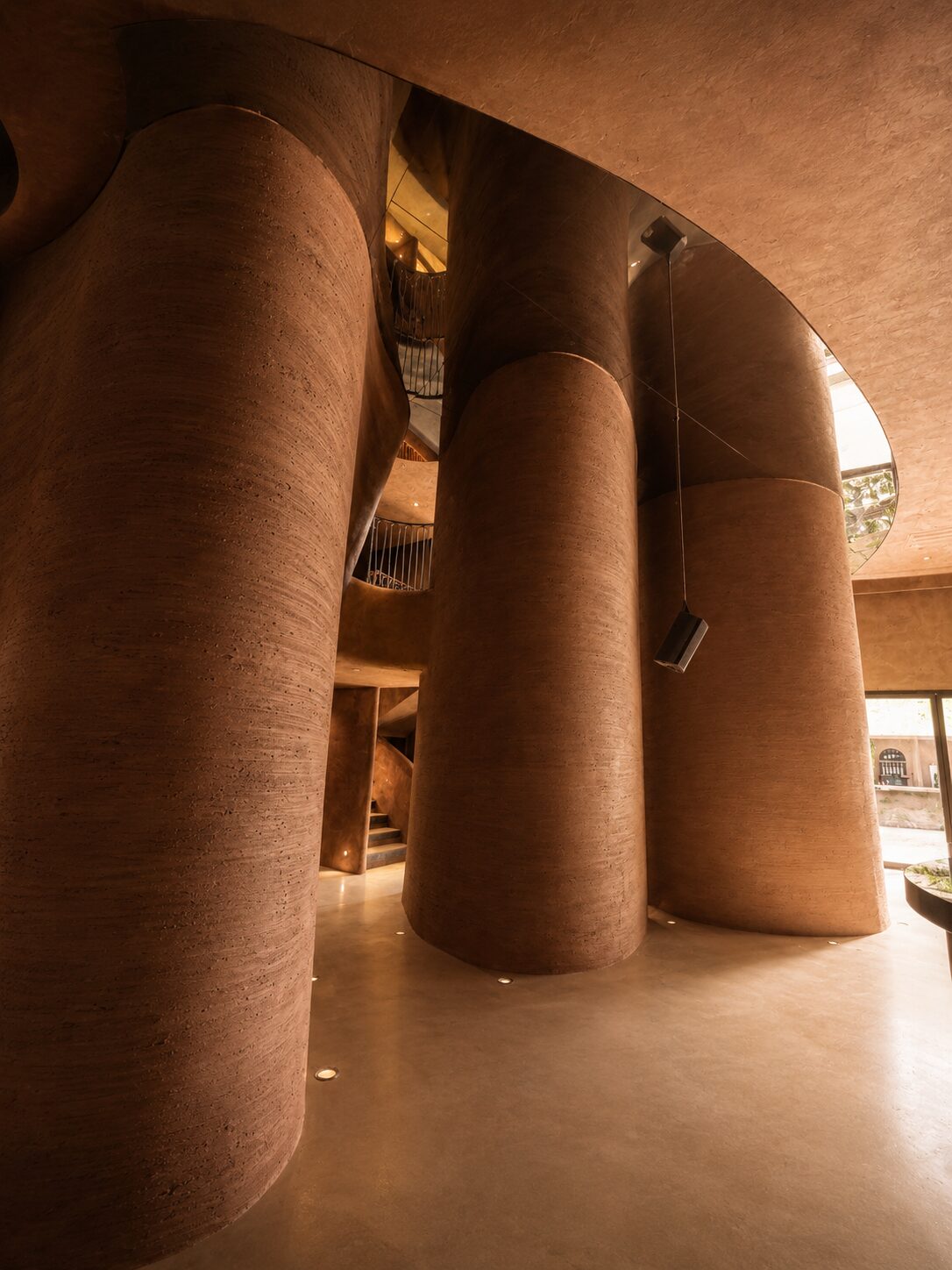 Cylindrical totems on Bro Club’s upper floor, organising access to the restroom area