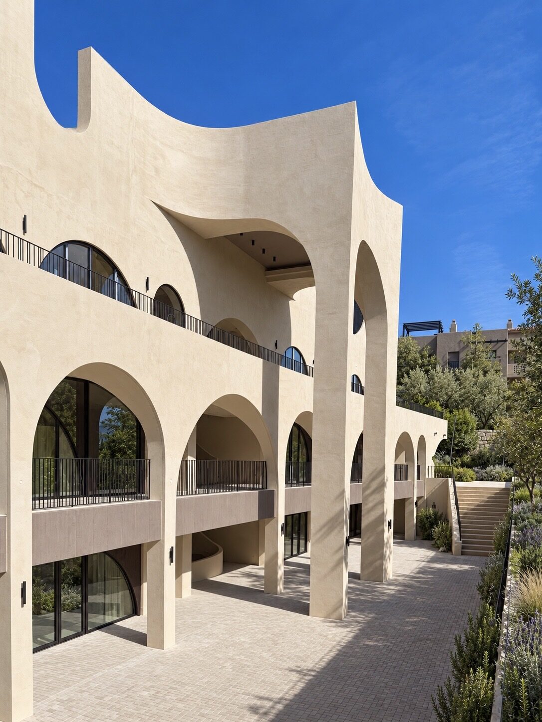 Patio Tramore, shopping centre in Benahavís: arched façade, completed work · Archidom Studio